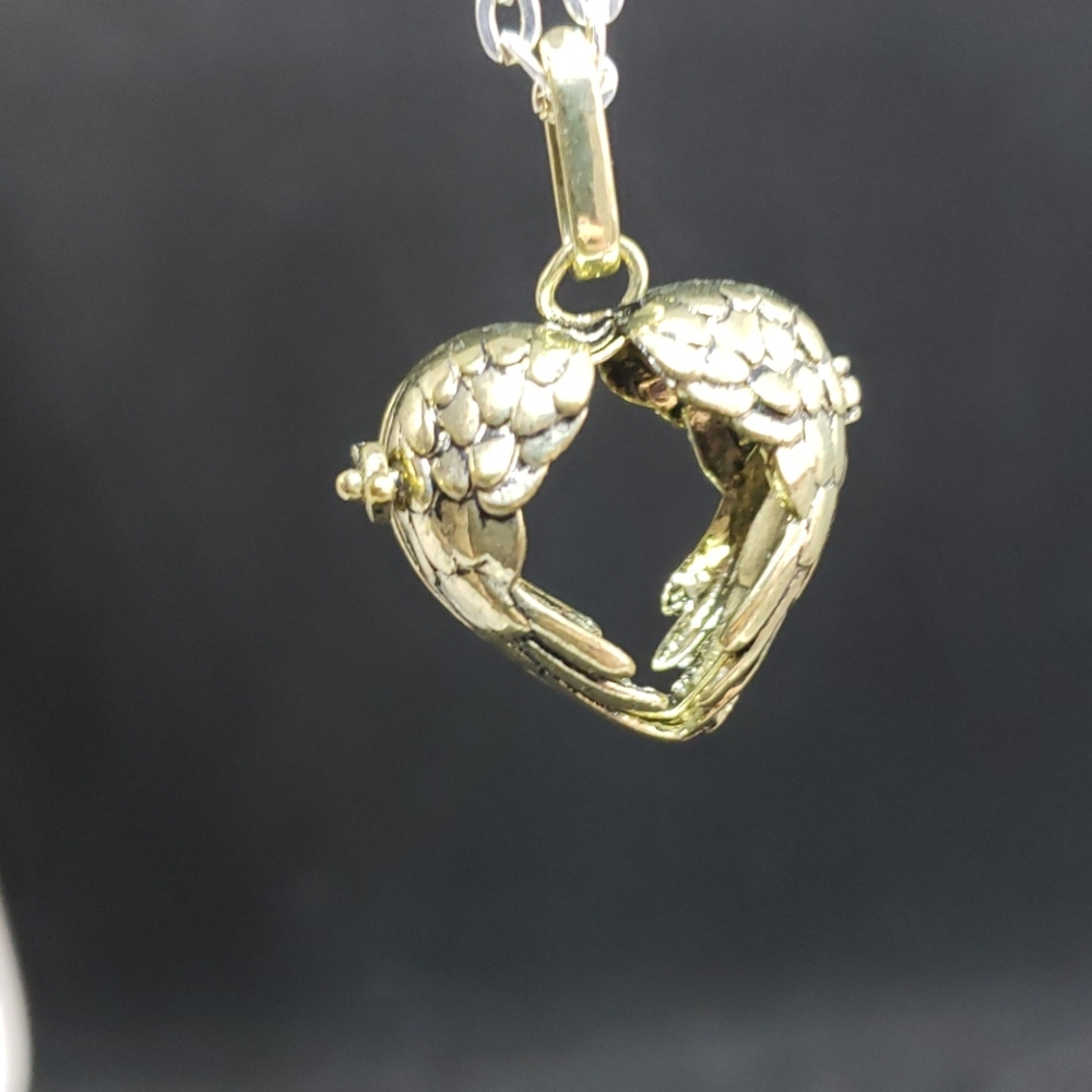 Gold tone heart angel/bird wing cage pendant
